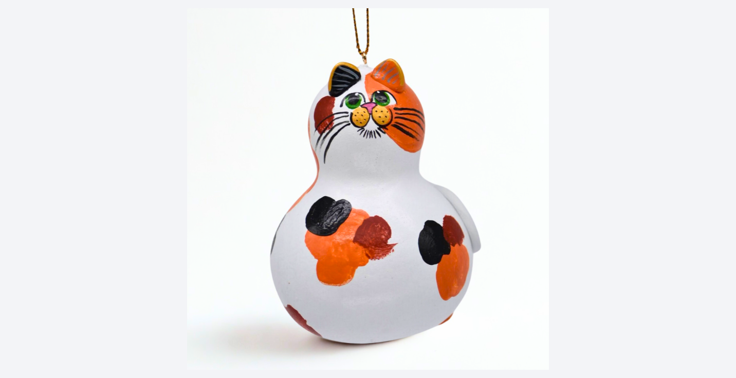 Hand painted calico cat ornament on natural dried gourd with unique markings