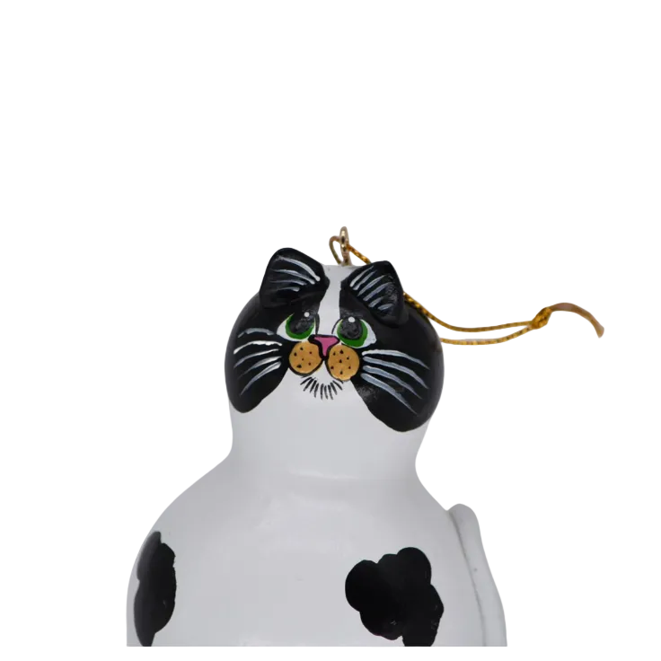 Hand painted cow cat gourd ornament inspired by a black and white cow cat named Oswald