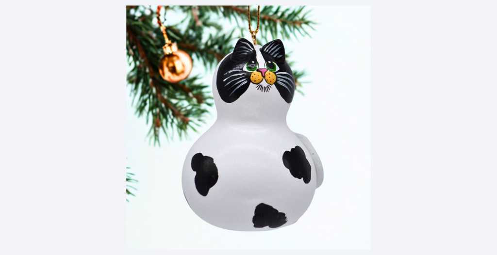 Hand painted cow cat ornament Oswald made from natural mini bottle gourd with black and white spots and gold hanging cord
