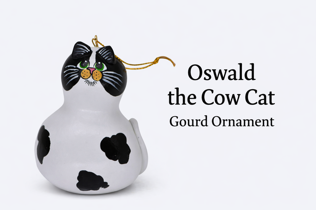 Hand painted cow cat ornament made from natural gourd with sculpted ears and tail, perfect cat lover gift