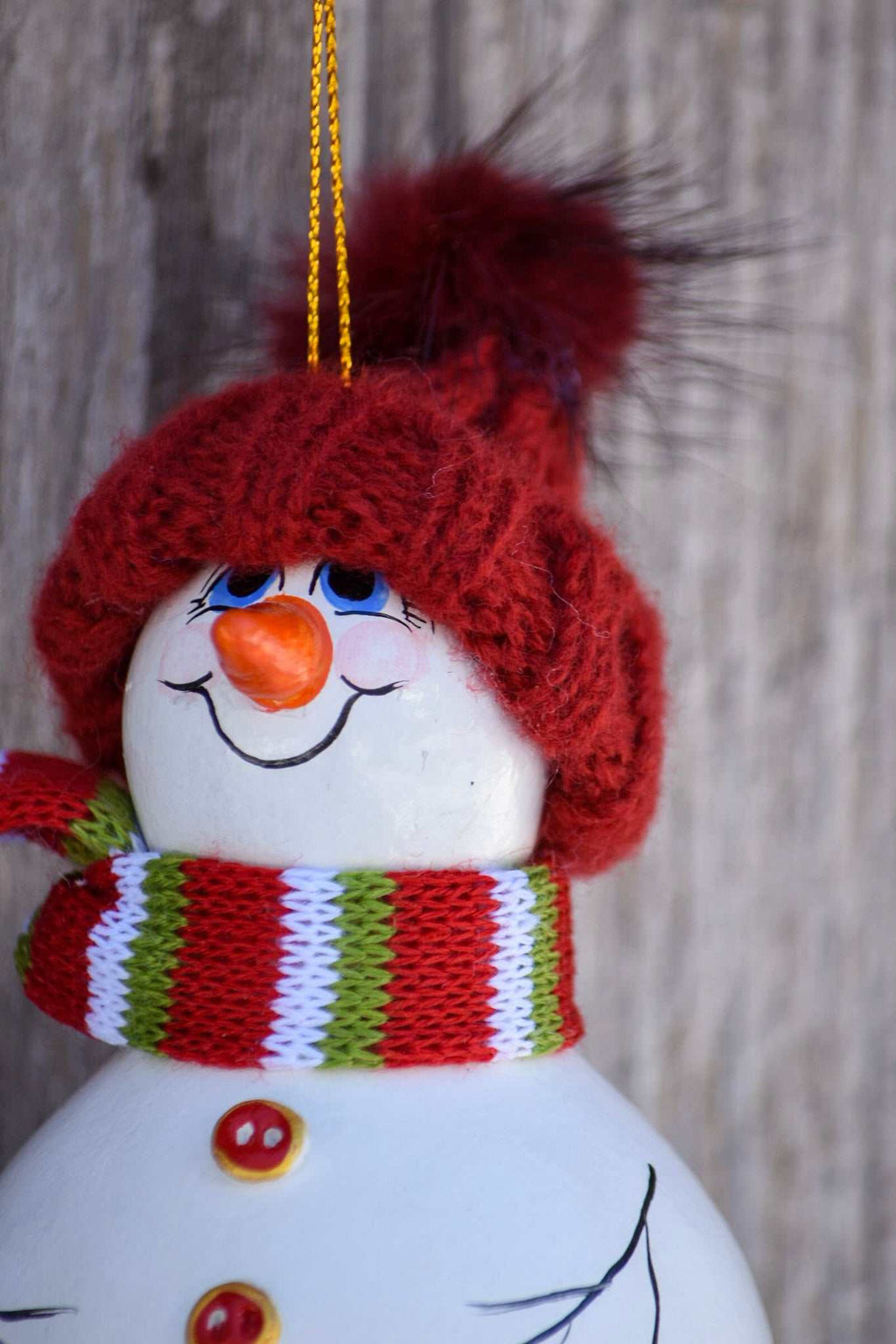 Hand painted snowman gourd ornament with red hat, festive holiday tree decoration