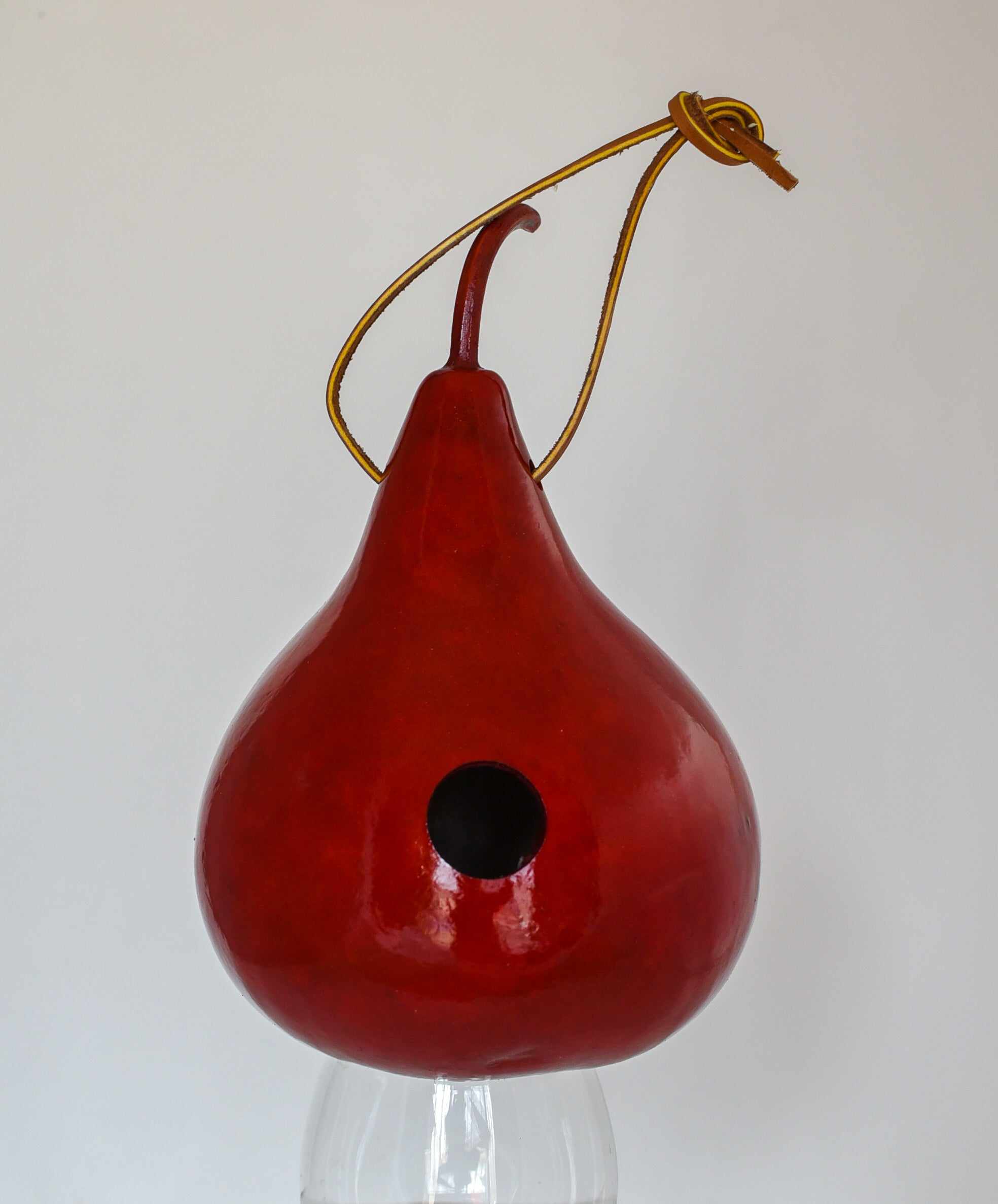 Handcrafted red gourd wren birdhouse with hanging cord and 1 1/8 inch entrance hole