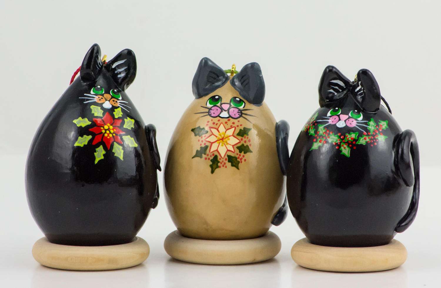 Kitty Cat Gourd Ornament Trio with holly and poinsettia designs on black and tan gourds Christmas decorations