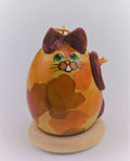Calico cat gourd art ornament with green eyes and brown patches, handcrafted Christmas decoration for cat lovers