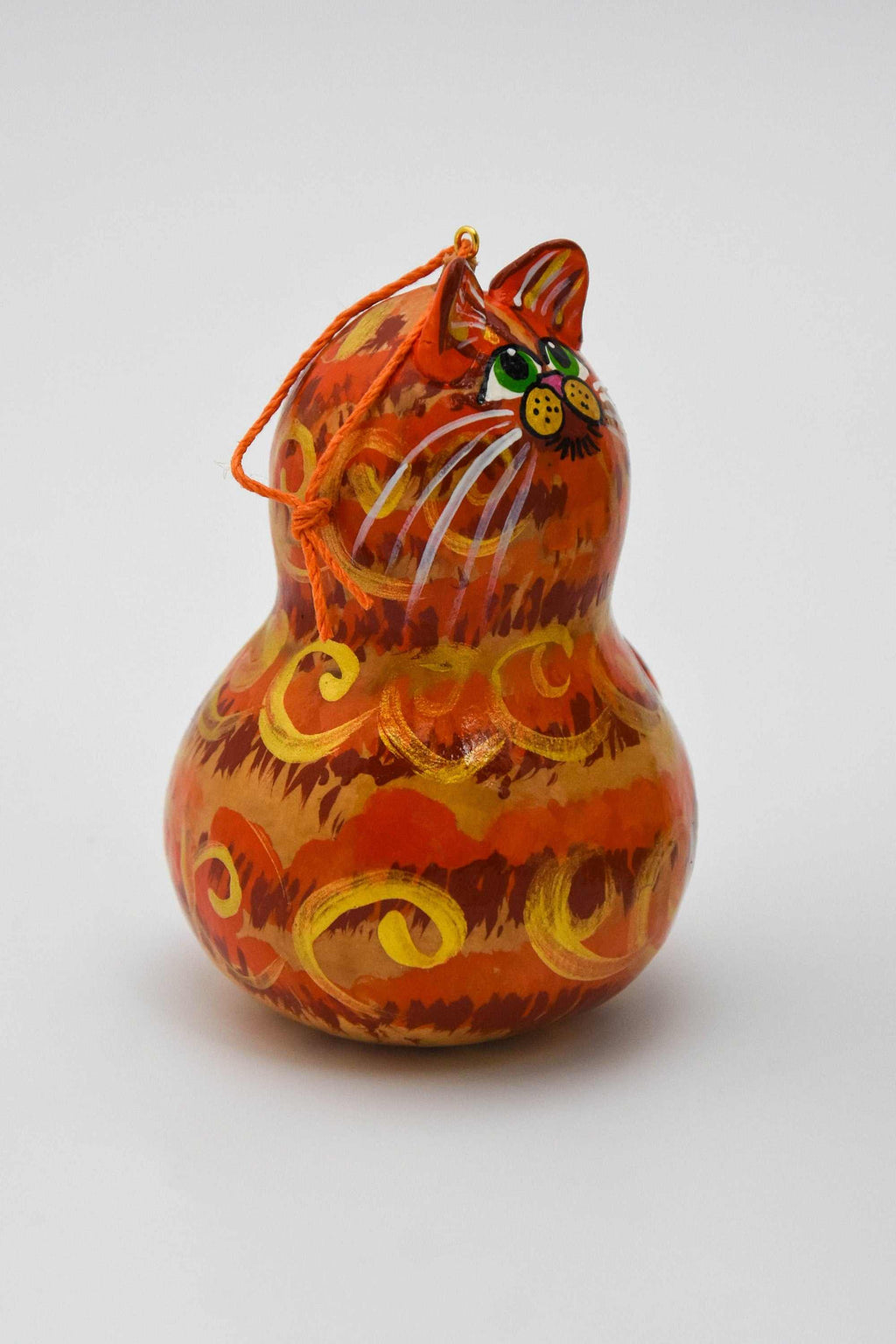 Orange tabby cat ornament gourd with painted details and hanging cord