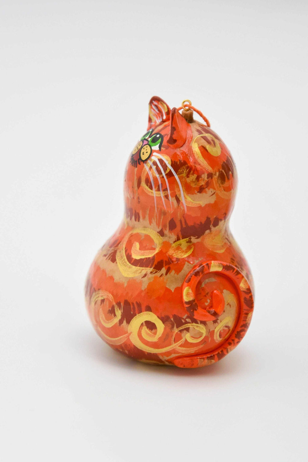 Orange tabby cat ornament made from painted gourd with resin ears and tail for Christmas decoration