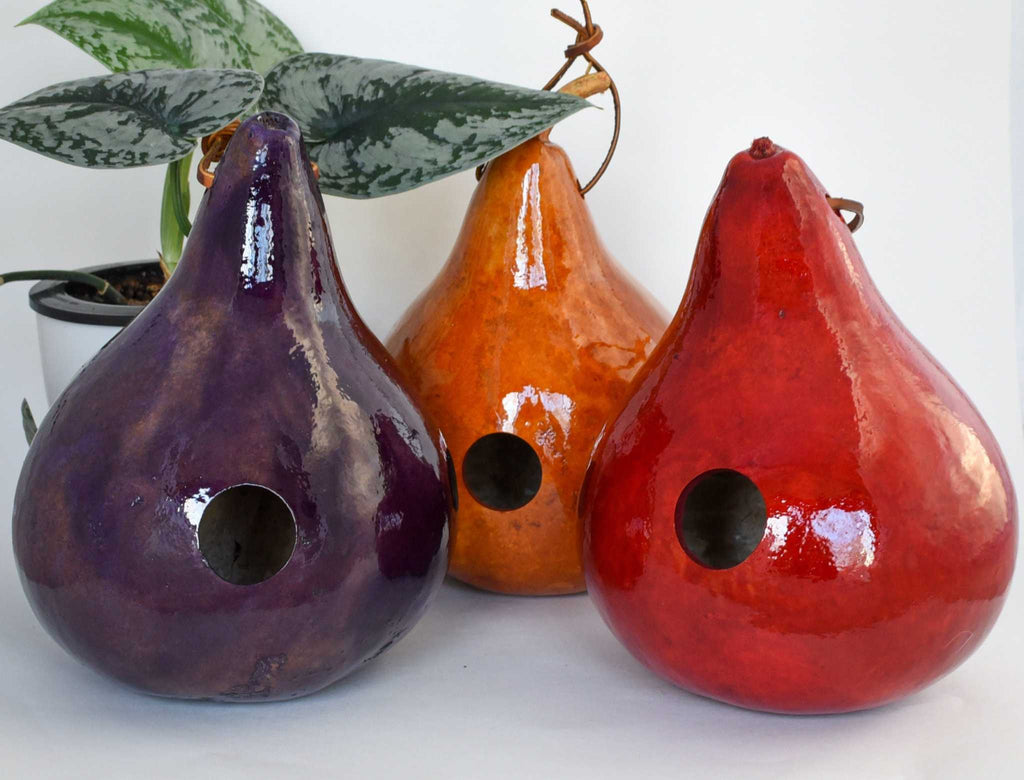 Set of 3 handmade colorful gourd birdhouses with hanging straps, ideal for outdoor garden décor and bird nesting.